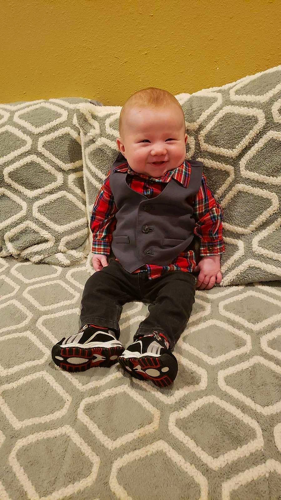 Steven is registered to the contest to win money with this photo: baby, baby_products, baby_toddler_clothing, carmine, cheek, child, child_model, cool, design, floor, flooring, joy, mouth, nose, outdoor_shoe, pattern, person, sitting, sleeve, textile