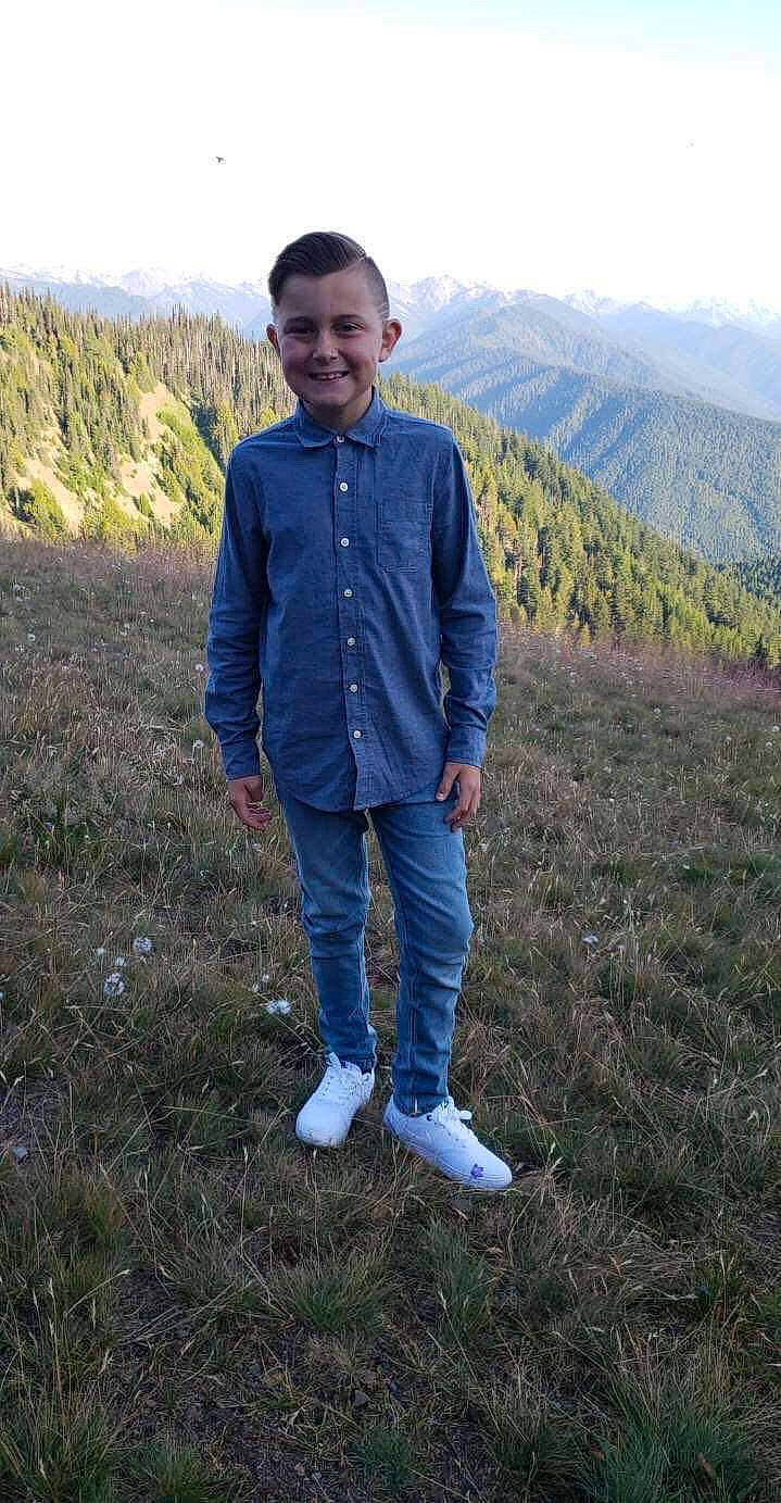 Jaedyn joined the competition — help win amazing prizes! denim, grass, grassland, hill, jacket, jeans, joy, mountain, outerwear, person, standing, vacation, wilderness