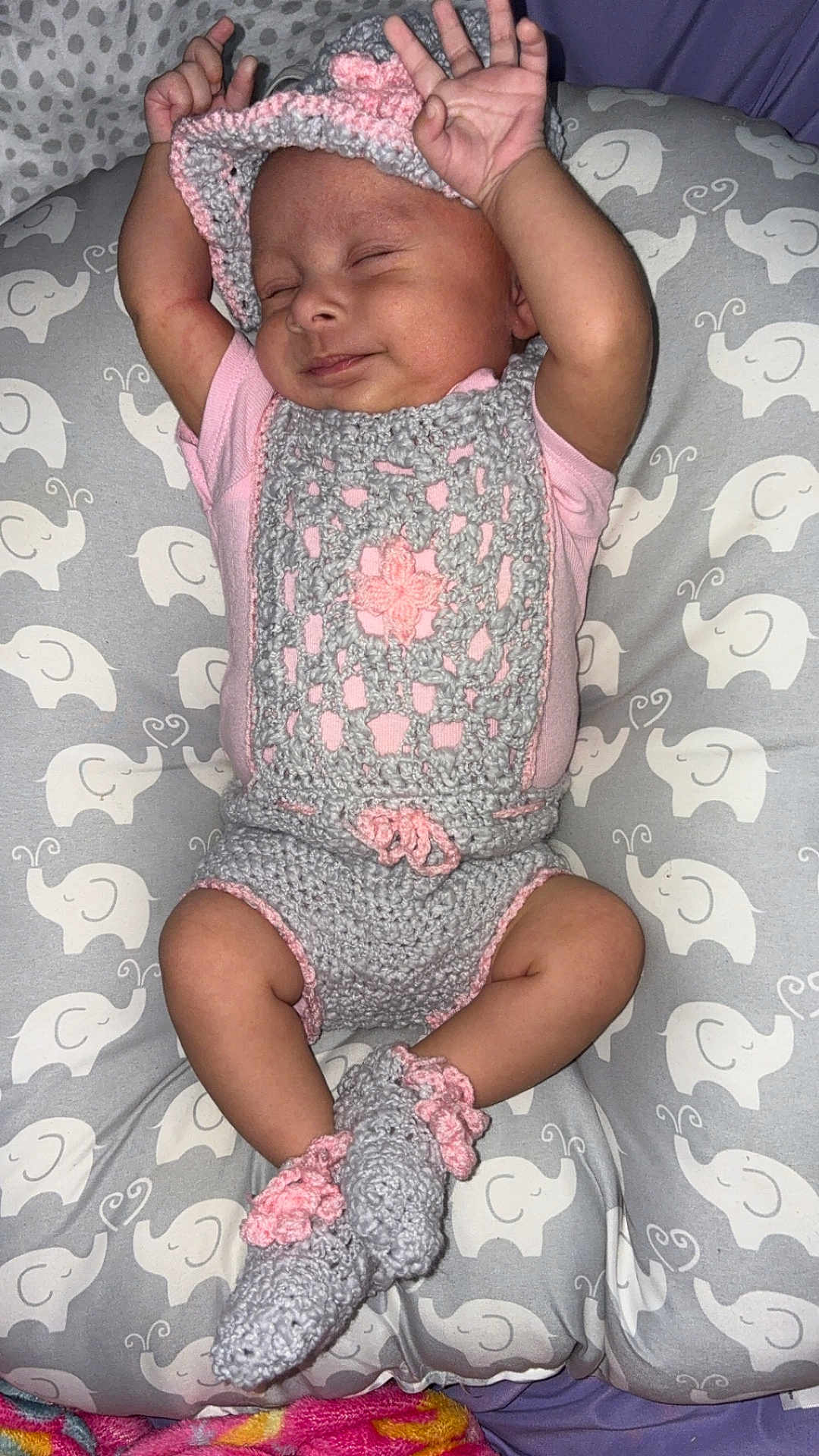 Yolyn joined the competition — help win amazing prizes! arms_up, baby, booties, child, cozy, crocheted_outfit, cushion, cute, elephant_pattern, gray, hat, indoors, infant, lying_down, newborn, peaceful, pink, resting, sleeping, soft_texture