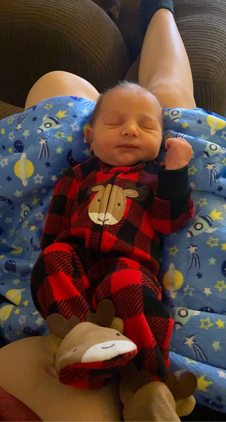 Huntley is registered to the contest to win money with this photo: baby, baby_products, baby_toddler_clothing, carmine, child, comfort, eye, head, lap, linens, orange, pattern, person, plaid, play, sitting, skin, sleeve, stuffed_toy, textile