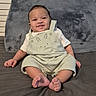 baby, bed, casual, child, clothing, comfortable, cushion, cute, face, feet, happy, indoor, infant, overalls, person, plush, portrait, sitting, smiling, young_child
