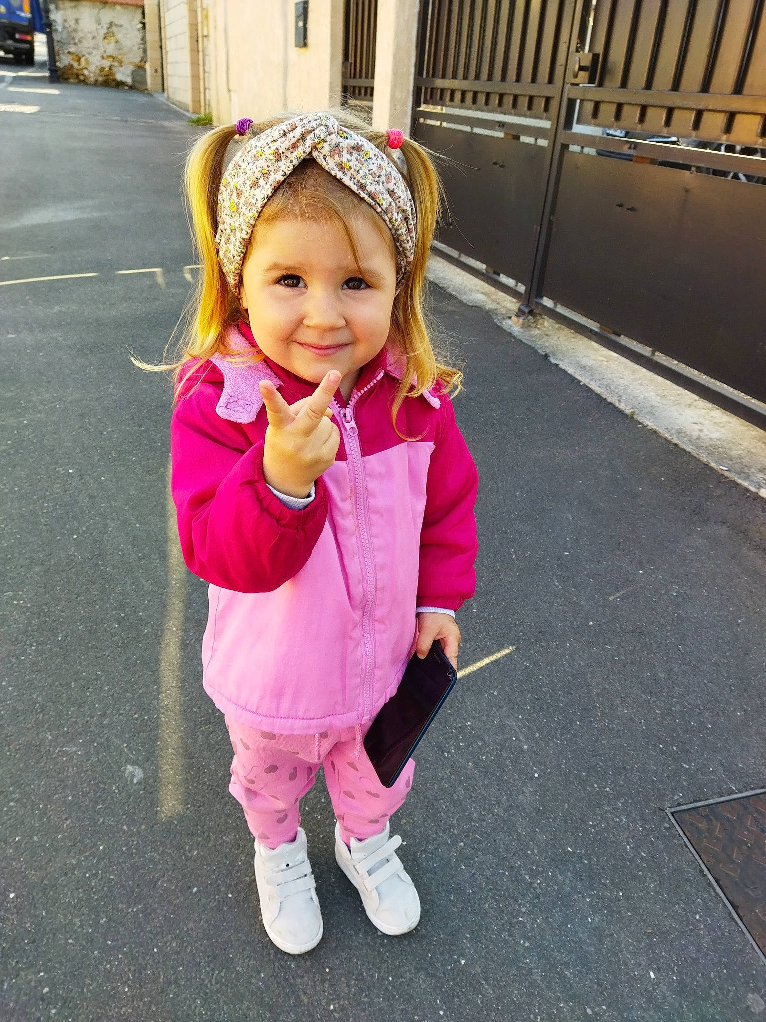 Victoria Sofronencu a rejoint le concours — aidez-le/la à gagner de superbes lots ! asphalt, blond, cap, fun, happy, headgear, headwear, jacket, joy, leisure, magenta, person, pink, plant, recreation, road_surface, sidewalk, sleeve, smile, street_fashion