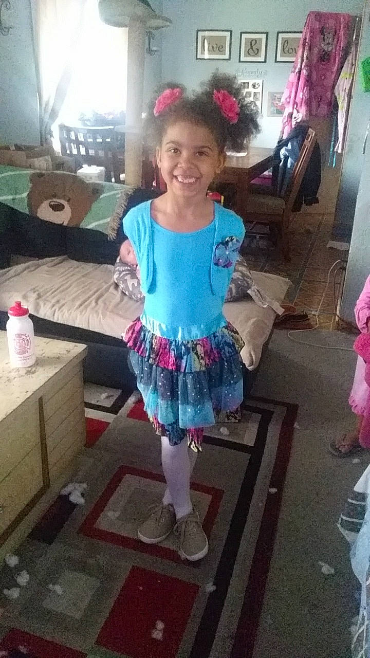 Nevaeh is registered to the contest to win money with this photo: ballet_tutu, child, clothing, costume, dress, fun, joy, person, pink, smile, technology, toddler