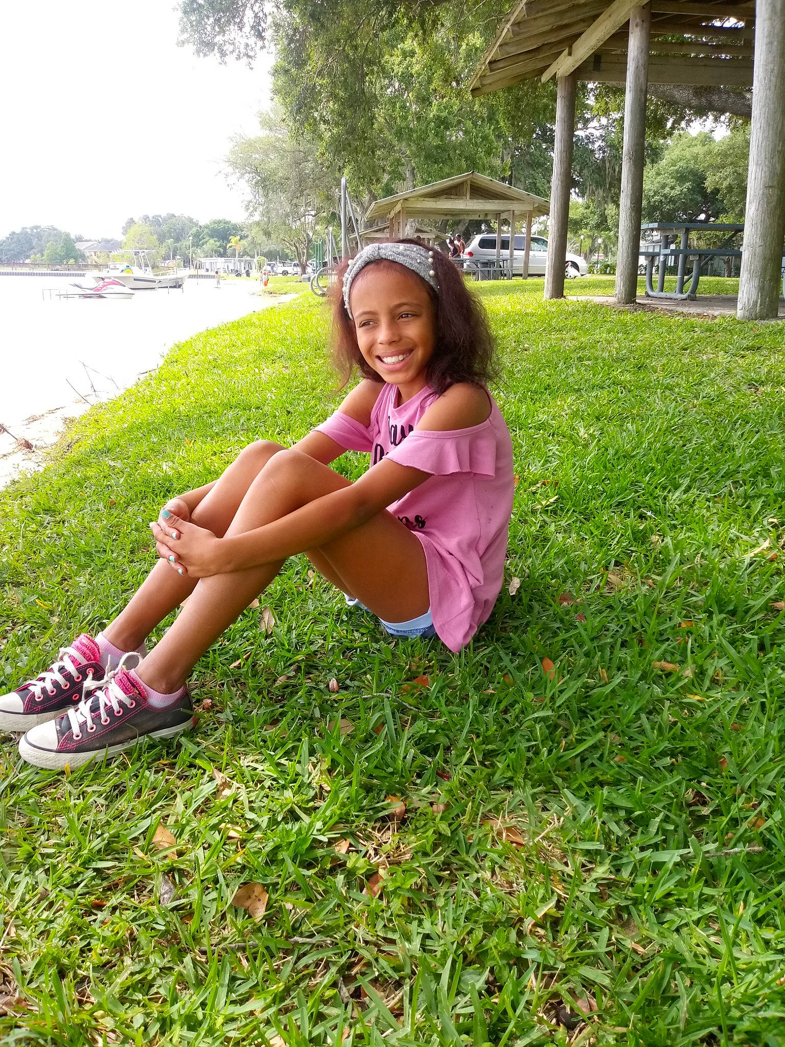 Zaryanna is registered to the contest to win money with this photo: beauty, child, footwear, fun, grass, grass_family, happy, joy, lawn, leg, leisure, long_hair, meadow, person, pink, plant, sitting, skin, smile, summer