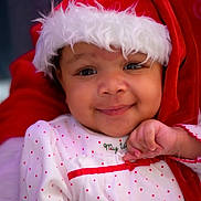 Cordelia joined the competition — help win amazing prizes! baby, child, smiling, santa_hat, christmas, holiday, red, white, polka_dot, cute, face, portrait, festive, infant, clothing, happy, closeup, winter, cheerful, hand