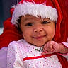 baby, child, smiling, santa_hat, christmas, holiday, red, white, polka_dot, cute, face, portrait, festive, infant, clothing, happy, closeup, winter, cheerful, hand