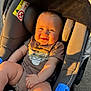 Lyana participe au concours pour gagner de l'argent avec cette photo : baby, child, car_seat, smiling, sunlight, onesie, cute, infant, happy, outdoor, seatbelt, clothing, face, skin, person, young_child, plush, safety, expression, sunshine