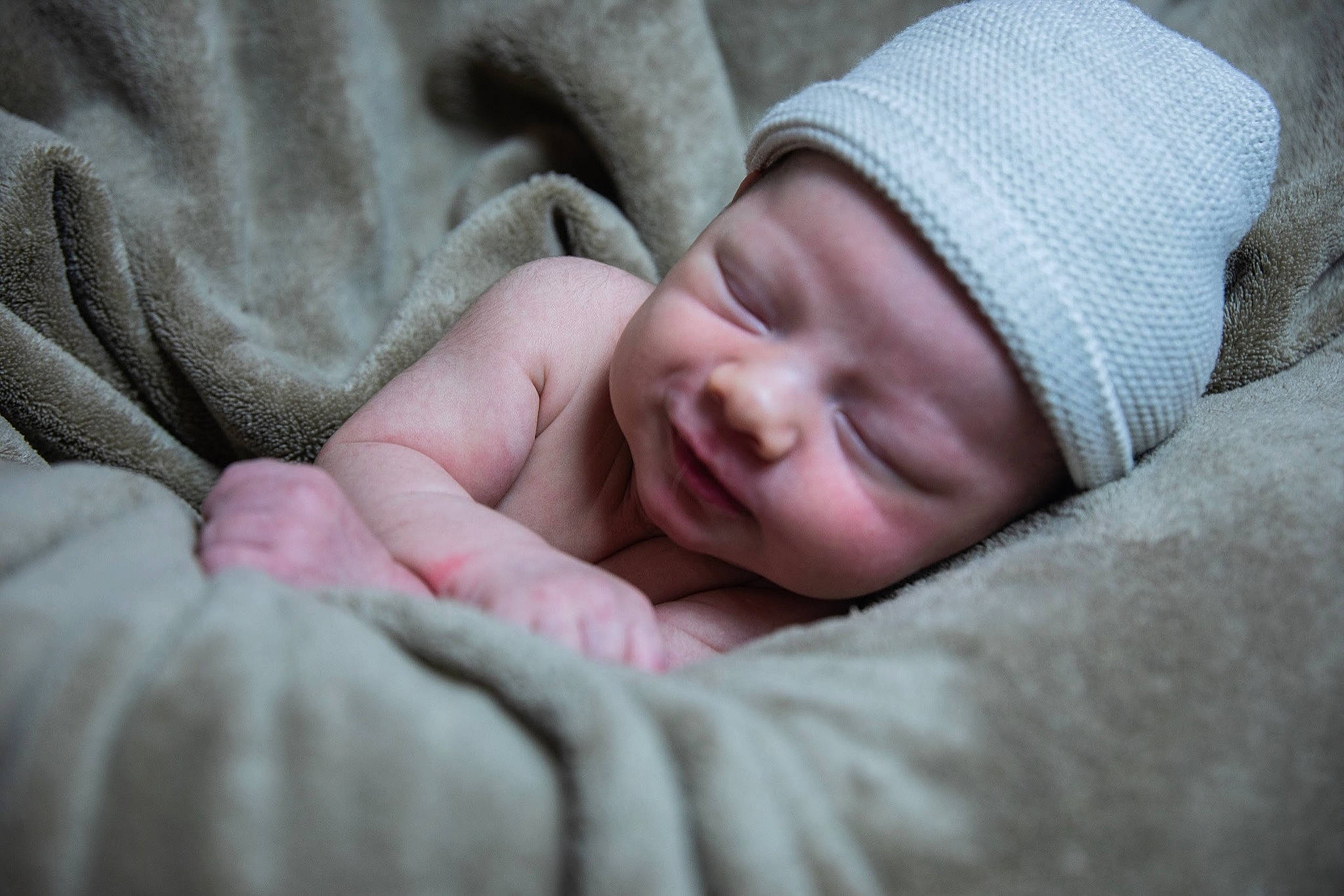 Grayson is registered to the contest to win money with this photo: baby, carmine, child, comfort, gesture, grass, headwear, linens, person, portrait_photography, toddler