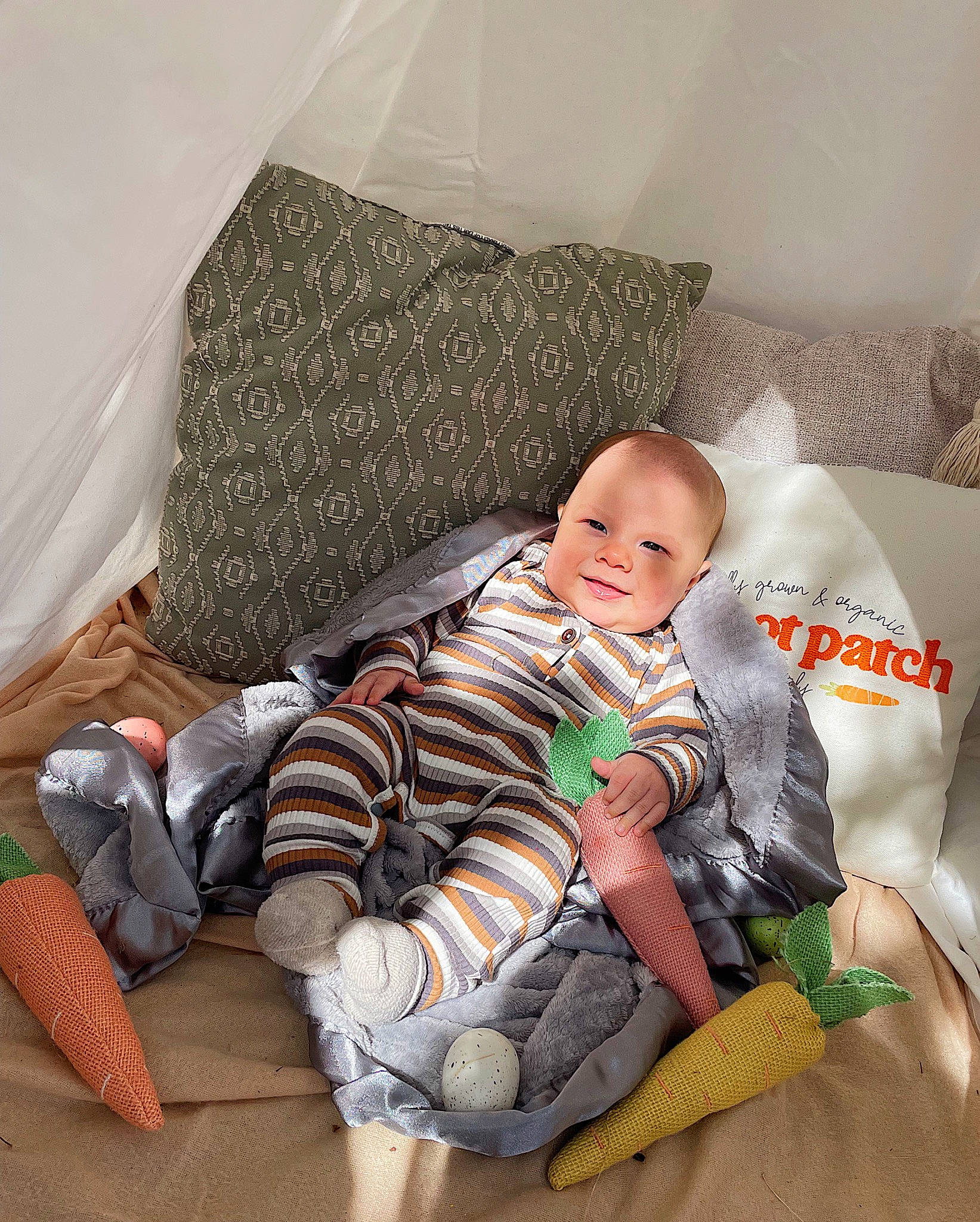 Grayson joined the competition — help win amazing prizes! baby, baby_sleeping, baby_toddler_clothing, bedtime, comfort, couch, lap, linens, pattern, person, pillow, room, sitting, sleeve, smile, sock, textile, thigh, throw_pillow, toddler