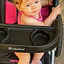 Adhara is registered to the contest to win money with this photo: toddler, child, stroller, babytrend, pink_bow, pink_clothing, purple_sandals, outdoor, baby, person, footwear, seat, handle, grip, cute, young_child, casual, summer, expression, portrait