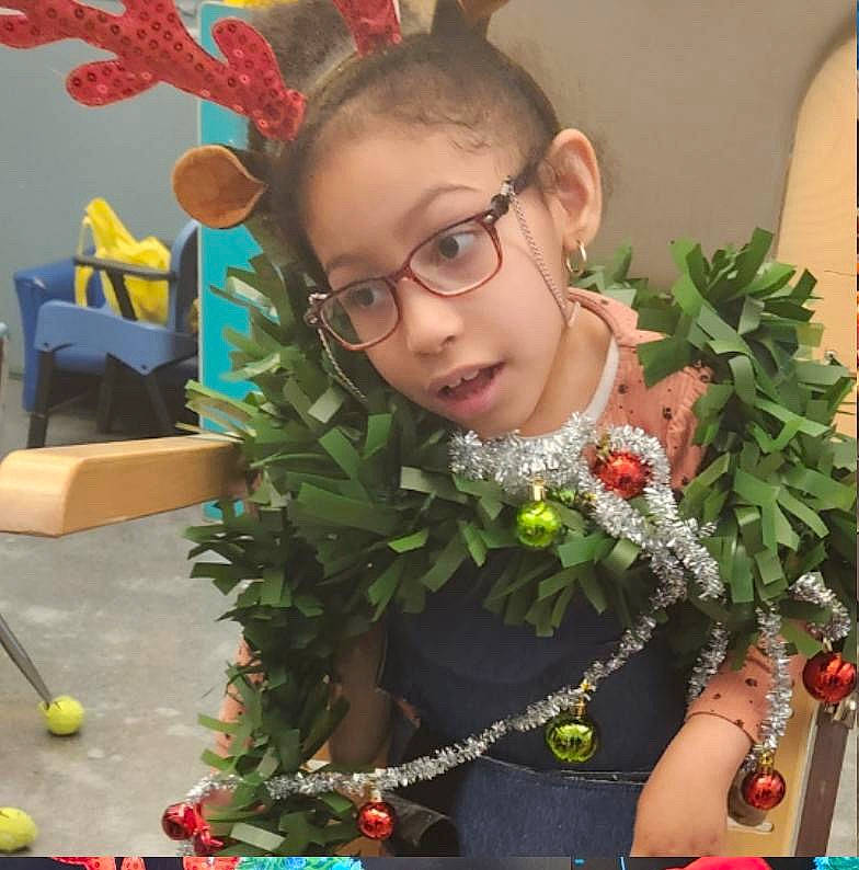 Genevieve is registered to the contest to win money with this photo: bouquet, child, cut_flowers, event, eyewear, fashion_accessory, floral_design, floristry, flower, flower_arranging, flowering_plant, fun, grass, happy, jewellery, lei, person, plant, snapshot, toddler