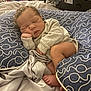 Adam is registered to the contest to win money with this photo: baby, sleeping, infant, cushion, patterned, blue, white, beige, blanket, cozy, soft, cute, peaceful, newborn, indoors, resting, child, person, portrait, hand