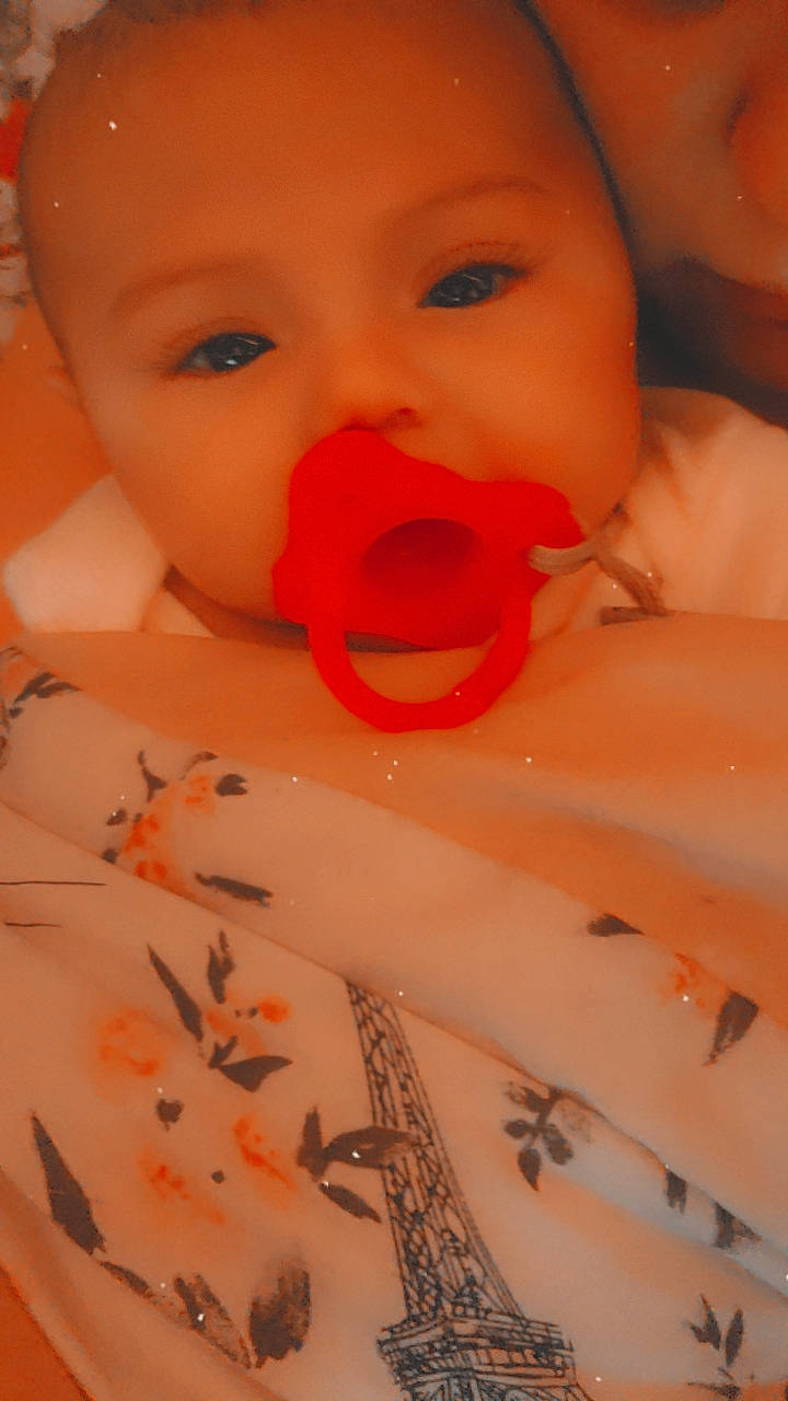 Eliana is registered to the contest to win money with this photo: baby, beauty, cheek, chin, close_up, eye, eyebrow, eyelash, finger, happy, head, iris, lip, mouth, nail, nose, orange, person, skin, toddler