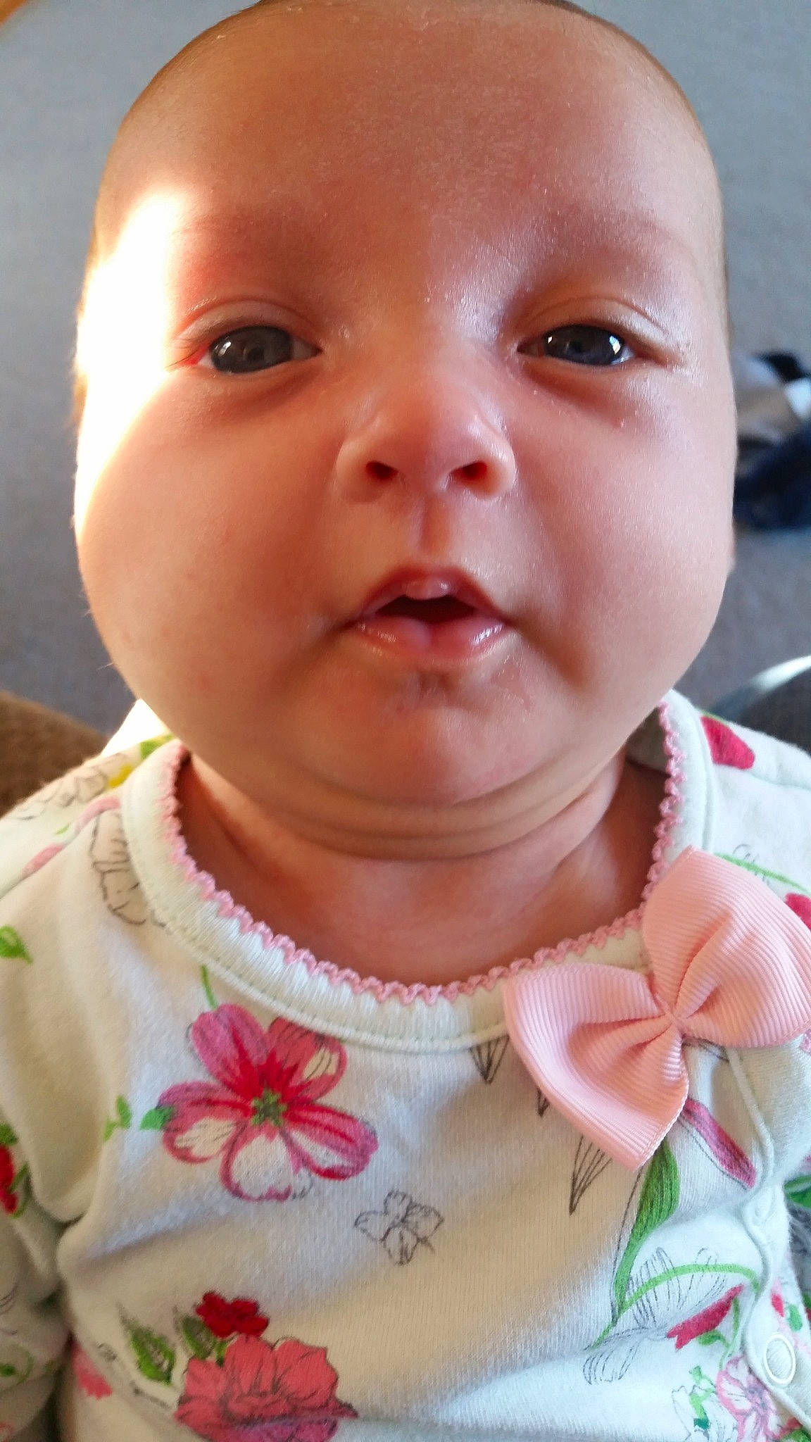 Nelda is registered to the contest to win money with this photo: baby, cheek, child, chin, close_up, ear, eye, face, facial_expression, forehead, head, lip, mouth, neck, nose, person, skin, smile, toddler