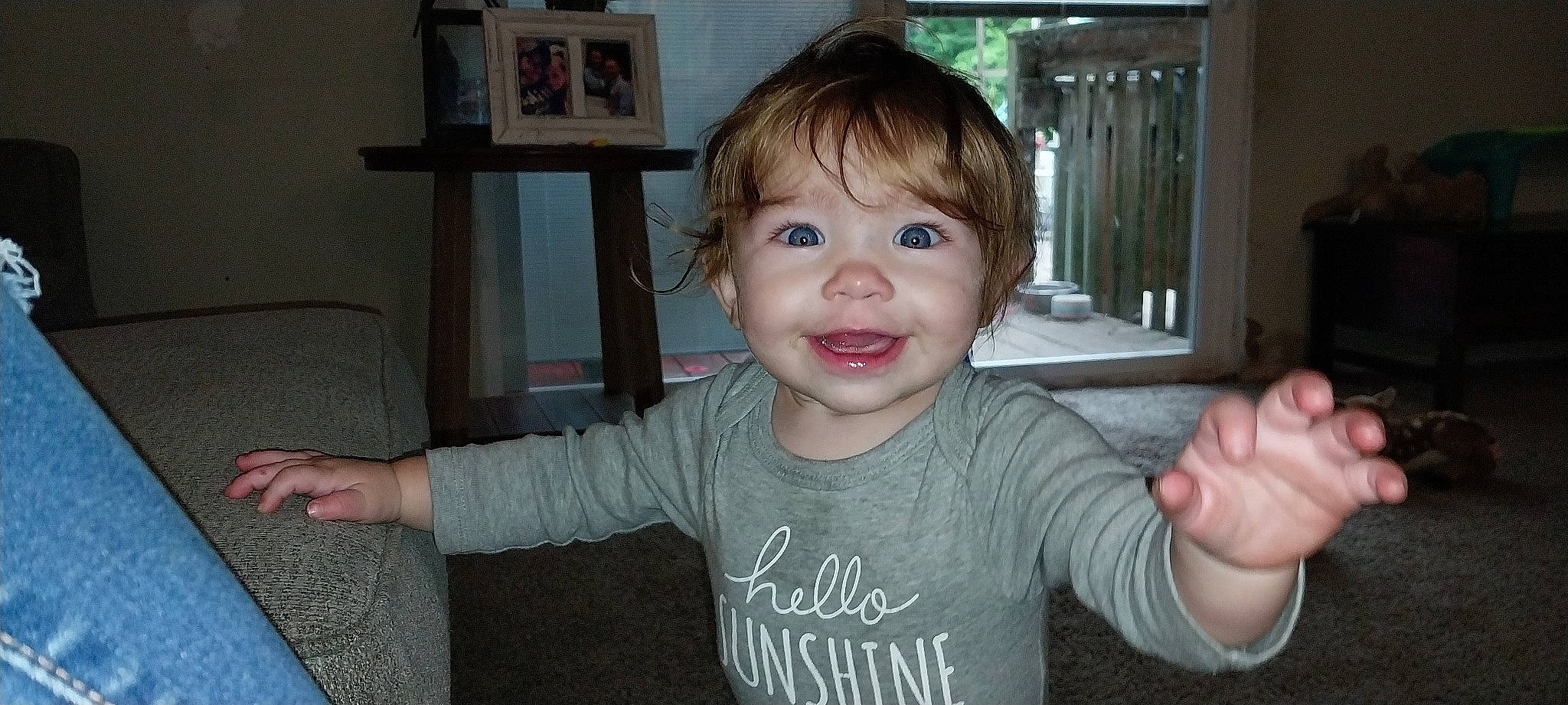 Neveah Rewalt is registered to the contest to win money with this photo: baby_toddler_clothing, bangs, cheek, child, ear, eyebrow, eyelash, finger, fun, gesture, happy, iris, nose, person, picture_frame, sitting, sleeve, smile, t_shirt, thumb