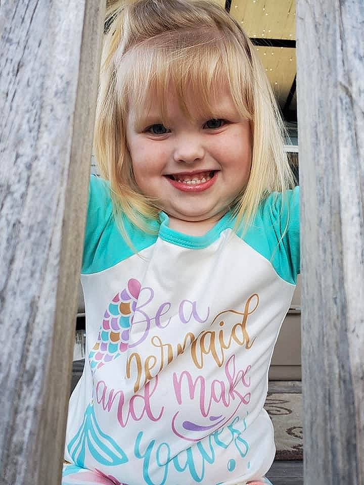 Annika joined the competition — help win amazing prizes! aqua, baby_toddler_clothing, cheek, eye, face, facial_expression, gesture, hair, hairstyle, happy, head, joy, organ, person, pink, product, sleeve, smile, summer, t_shirt