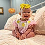 Gwendolyn joined the competition — help win amazing prizes! baby, child, smiling, headband, yellow_bow, pink_clothing, striped, lemon_pattern, sitting, blanket, soft_texture, indoors, couch, happy, cute, infant, person, portrait, feet, hands