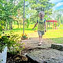 Jameson joined the competition — help win amazing prizes! child, toddler, barefoot, yellow_shirt, shorts, stone_path, garden, flowers, greenery, trees, sunny, outdoor, grass, pergola, potted_plants, nature, daylight, walking, summer, playful