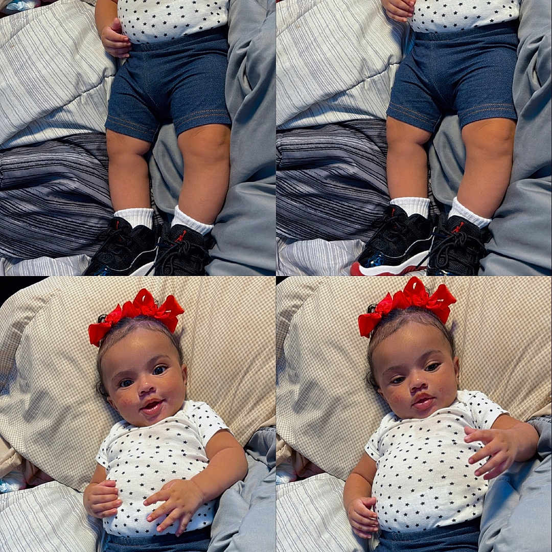 Lailanii is registered to the contest to win money with this photo: baby, bed, black_sneakers, blanket, blue_shorts, child, comb, cute, four_panel, happy, indoors, infant, pillow, portrait, red_bow, relaxed, smiling, star_pattern, white_shirt, white_socks