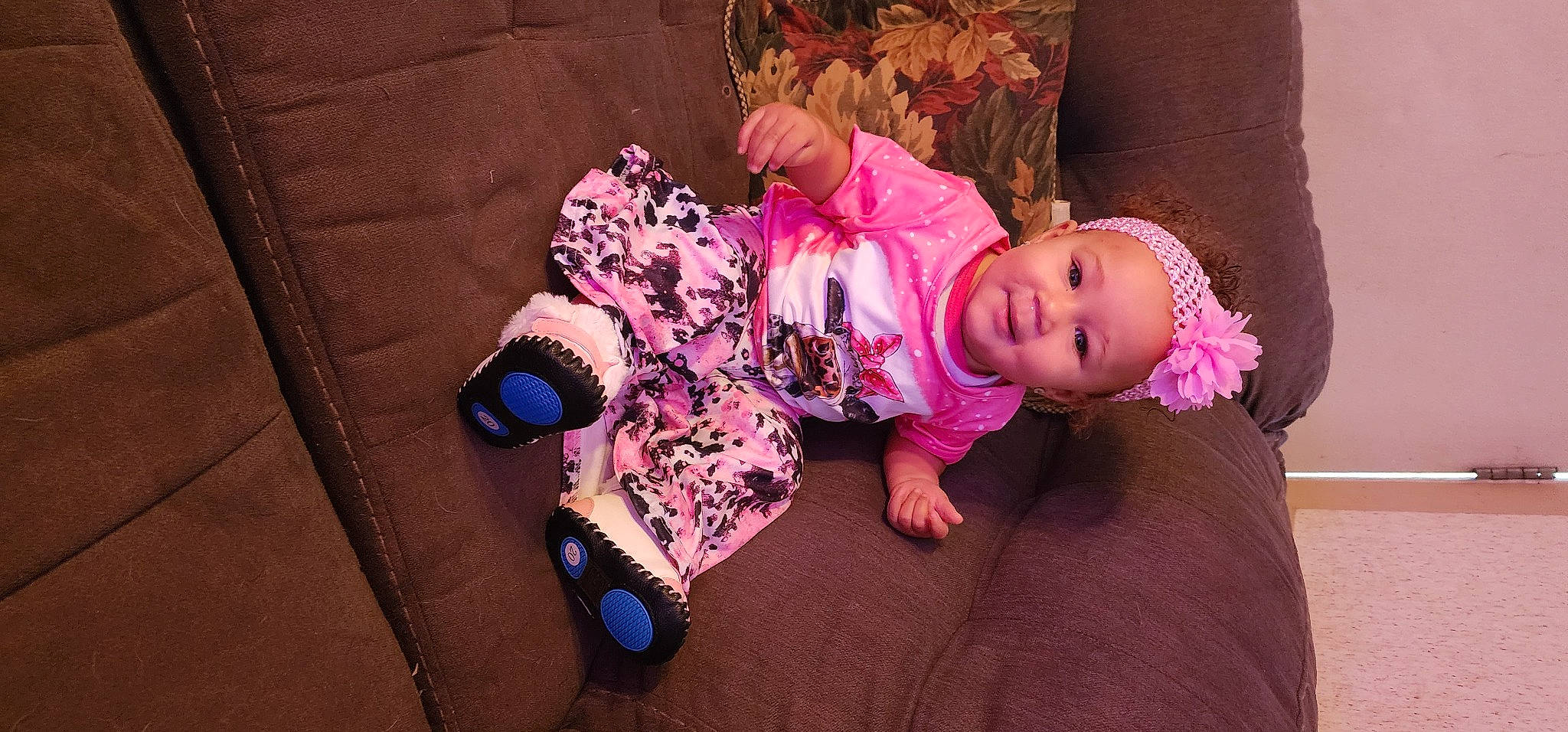 Alana Thomas is registered to the contest to win money with this photo: baby, baby_toddler_clothing, cheek, child, comfort, floor, flooring, fun, human_body, leg, magenta, person, pink, purple, sitting, skin, sleeve, sock, toddler, violet
