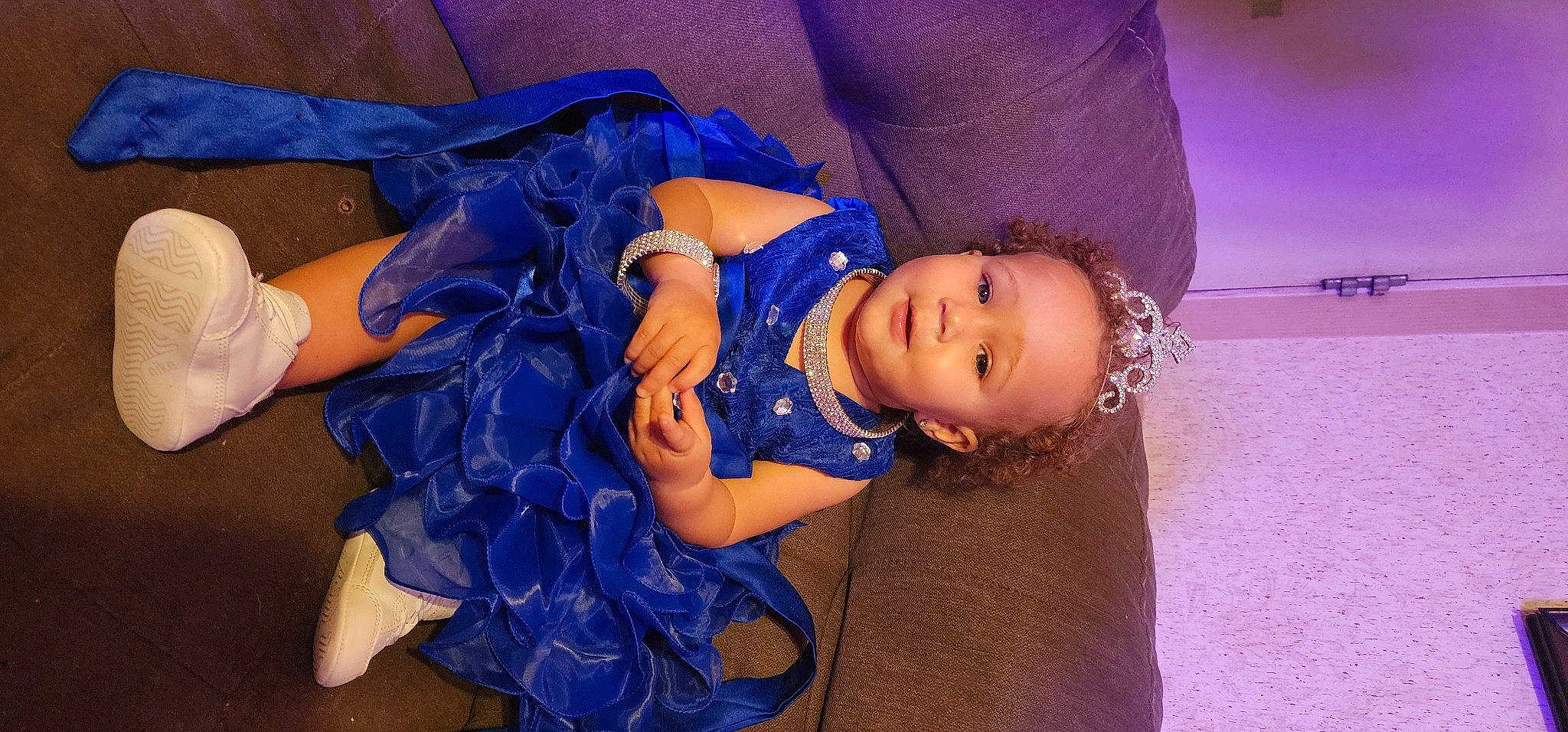 Alana is registered to the contest to win money with this photo: abdomen, baby, baby_toddler_clothing, child, cloud, electric_blue, flash_photography, fun, happy, hat, human_leg, magenta, person, purple, sitting, skin, smile, toddler, violet