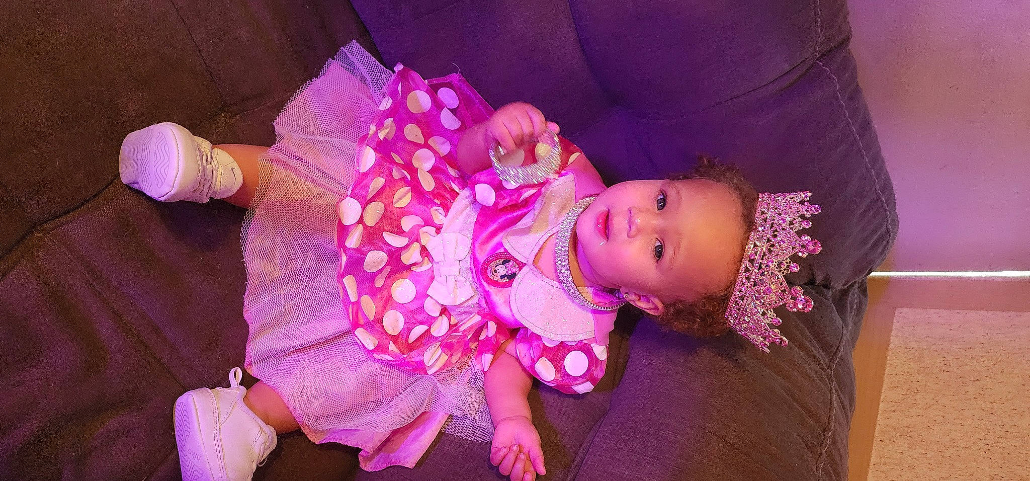 Alana is registered to the contest to win money with this photo: baby, baby_toddler_clothing, child, dress, event, eye, fashion_accessory, fun, headband, headgear, headpiece, magenta, person, pink, purple, skin, sleeve, textile, toddler, toy