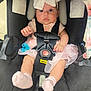 adorable, baby, bow, car_seat, child, child_safety, close_up, cute, headwear, indoor, infant, pacifier, person, pink_clothing, seatbelt, sitting, socks, soft_fabric, wide_eyes, young_child