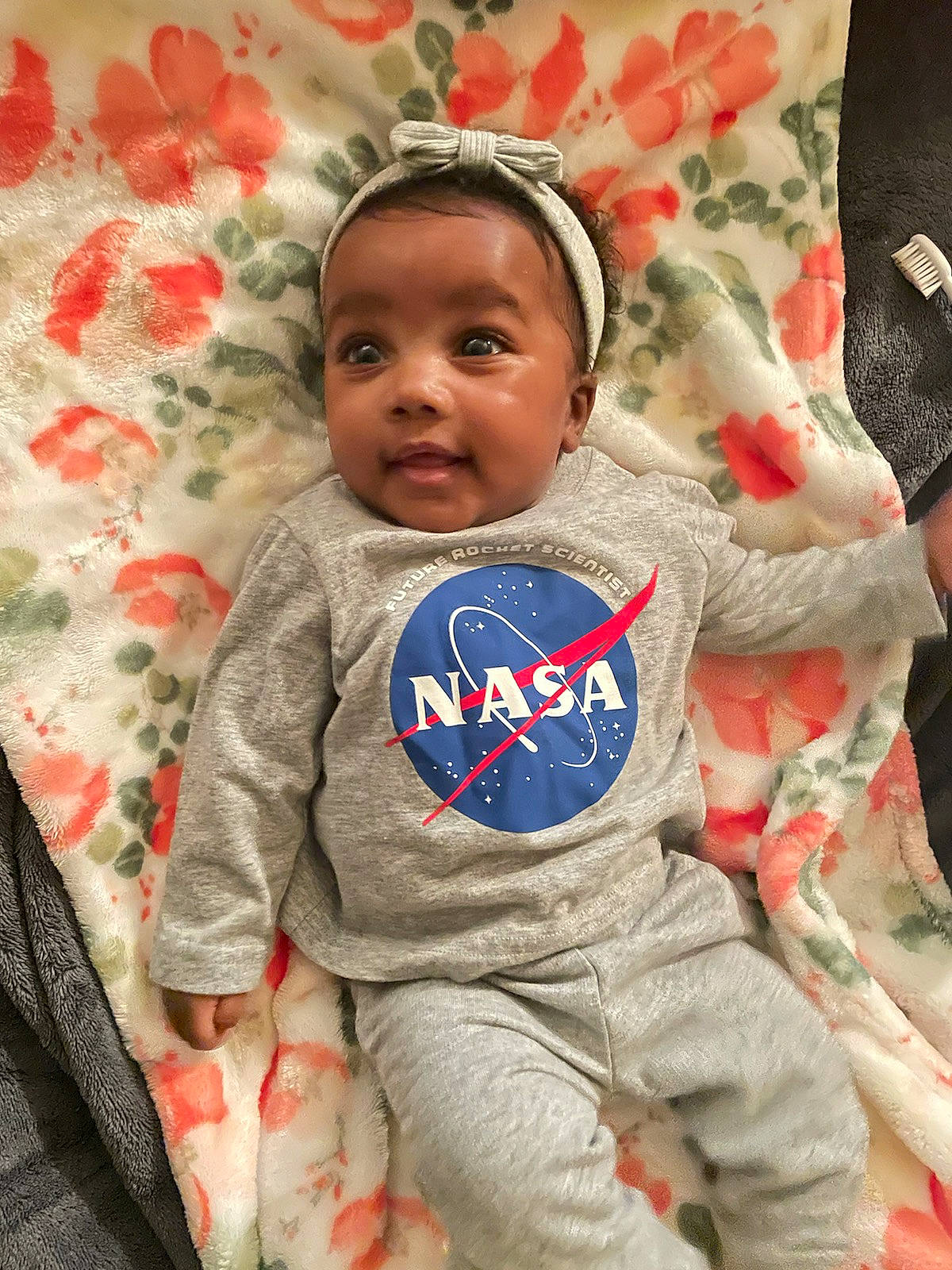 Lauren joined the competition — help win amazing prizes! baby, baby_products, baby_toddler_clothing, carmine, cheek, child, comfort, costume_hat, face, fun, happy, head, human, linens, pattern, person, sitting, skin, sleeve, t_shirt