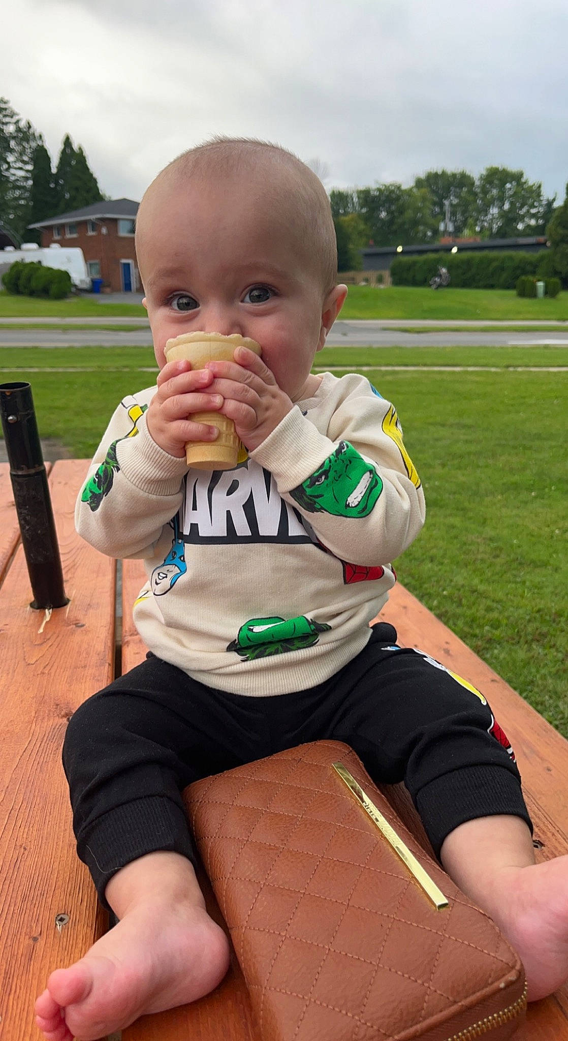 Oliver is registered to the contest to win money with this photo: baby, baby_toddler_clothing, cloud, face, finger, fun, gesture, grass, happy, knee, leisure, person, shorts, sitting, sky, sleeve, summer, thigh, thumb, toddler