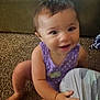 Estella joined the competition — help win amazing prizes! toddler, child, crawling, purple_clothing, indoor, carpet, smiling, baby, young_child, person, hand, foot, face, hair, furniture, pattern, polka_dot, curious, grip, home