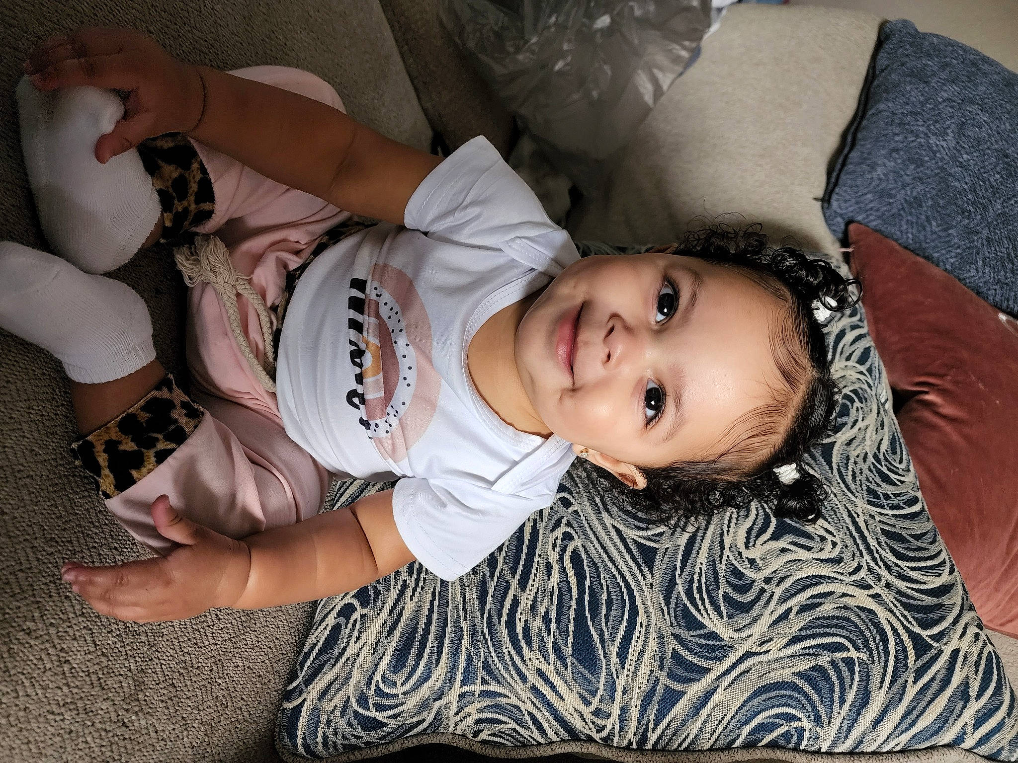 Laylani is registered to the contest to win money with this photo: baby_toddler_clothing, black_hair, chest, child, comfort, cool, elbow, flash_photography, fun, happy, human_body, joy, knee, leg, mouth, person, skin, smile, thigh, toddler