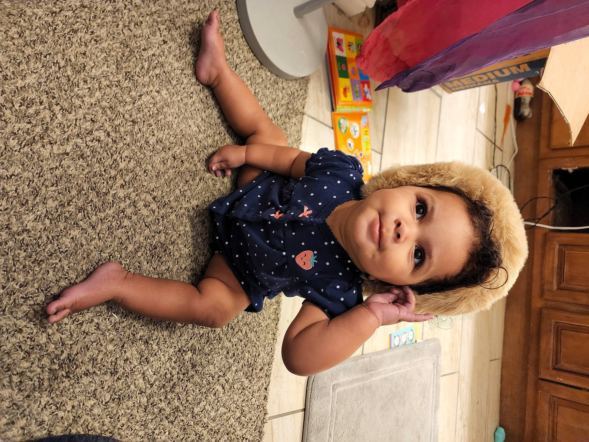 Laylani joined the competition — help win amazing prizes! cabinetry, child, drawer, drum, flooring, fun, happy, hat, human_leg, leisure, musical_instrument, pattern, person, play, room, sitting, smile, t_shirt, thigh, toddler