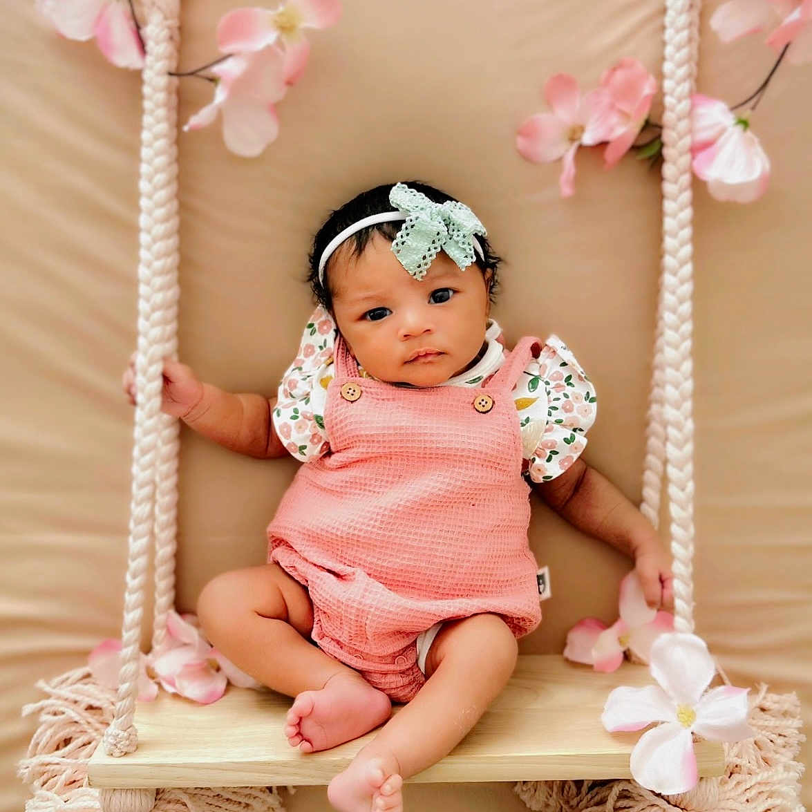 Deari is registered to the contest to win money with this photo: baby, clothing, crib, dress, face, flower, furniture, happy, hat, head, infantbed, newborn, person, photography, plant, playarea, portrait, sitting, smile, toy
