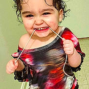 Alleah joined the competition — help win amazing prizes! barefoot, cheeky, child, colorful_clothing, curly_hair, cute, door, dress, expression, floor, fun, happy, indoor, person, playful, smiling, standing, string, toddler, young_child