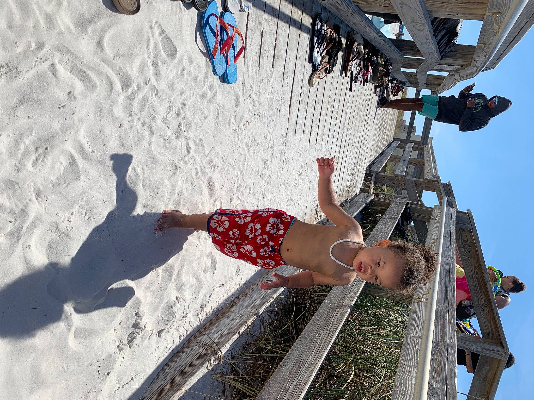 Amare is registered to the contest to win money with this photo: beach, fun, hat, human_leg, leisure, pedestrian, person, recreation, shadow, shorts, sky, t_shirt, thigh, tire, vacation, wheel, white, winter, world