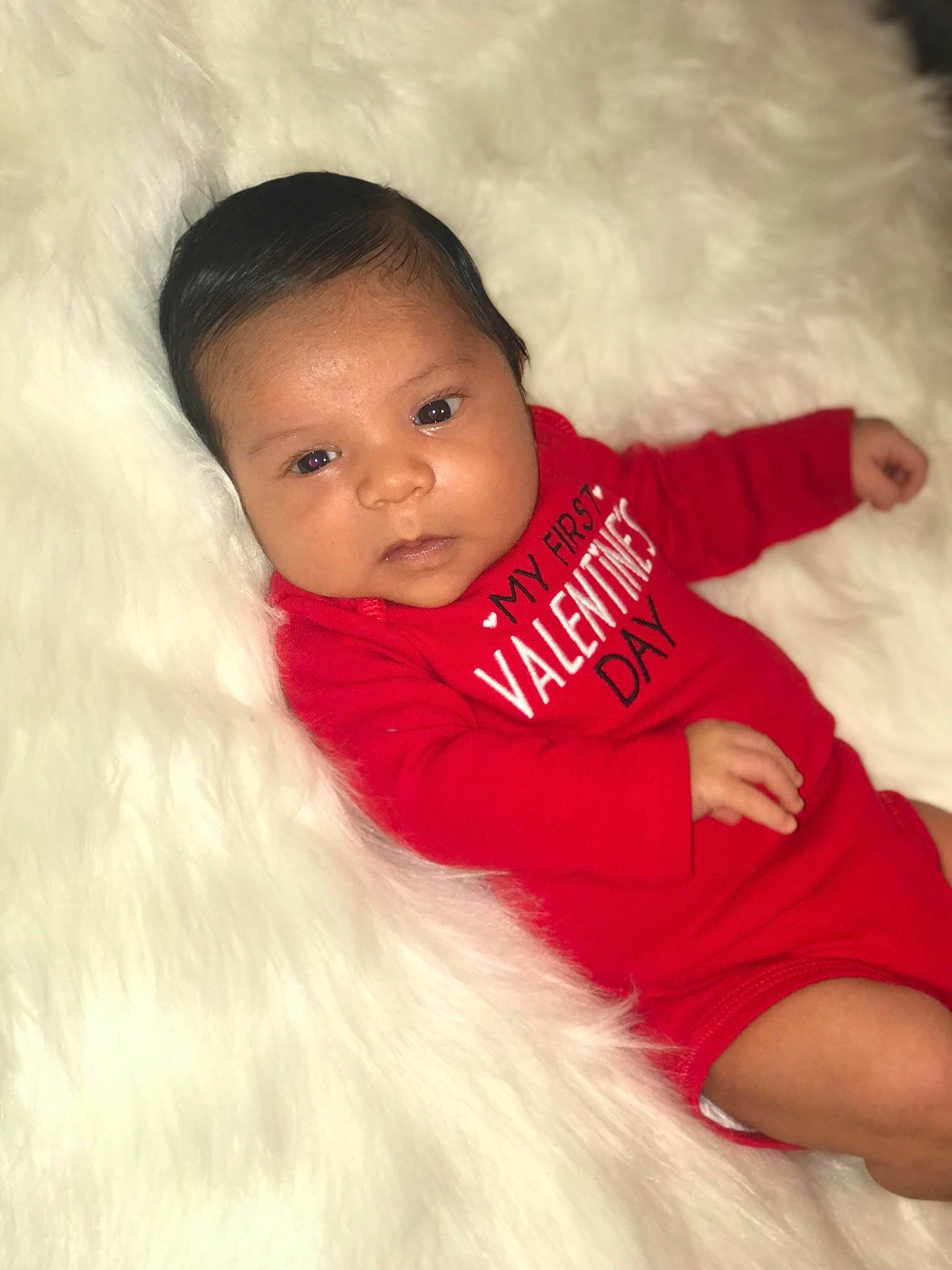 Arian is registered to the contest to win money with this photo: baby, cheek, child, eye, face, fun, fur, happy, head, lip, nose, people, person, photography, pink, red, sitting, skin, smile, toddler