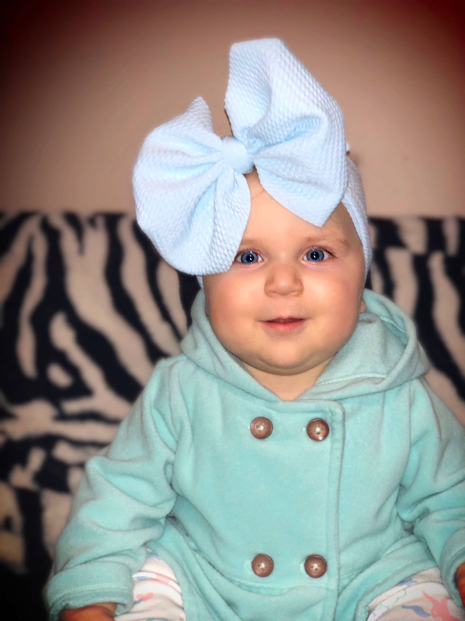 Jazlyn Grace is registered to the contest to win money with this photo: beanie, bonnet, cap, child, ear, girl, hair_accessory, hat, headgear, infant, knit_cap, nose, person, product, skin, smile, toddler