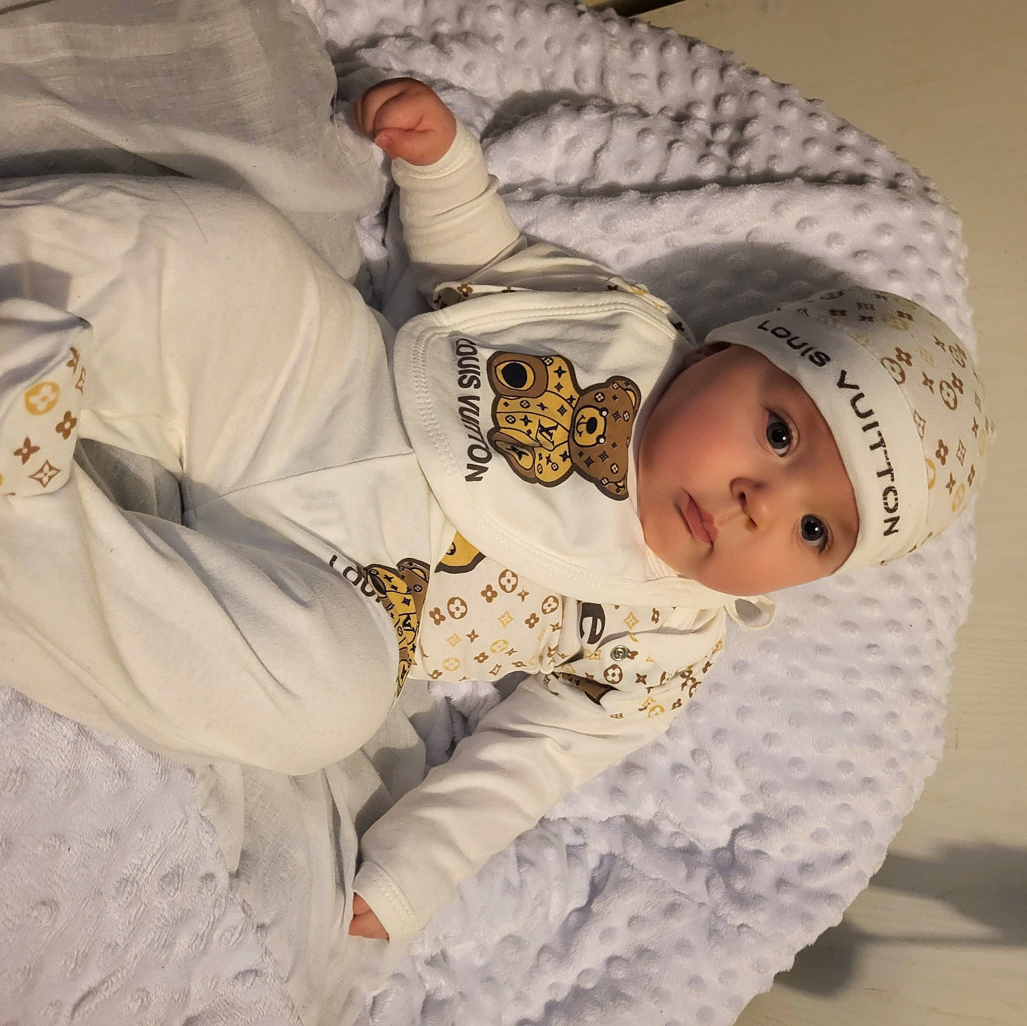 Lenny-jay is registered to the contest to win money with this photo: arm, baby, baby_sleeping, baby_toddler_clothing, beanie, bedtime, child, comfort, fur, headwear, human_body, knit_cap, linens, nap, pattern, person, product, room, sitting, sleeve