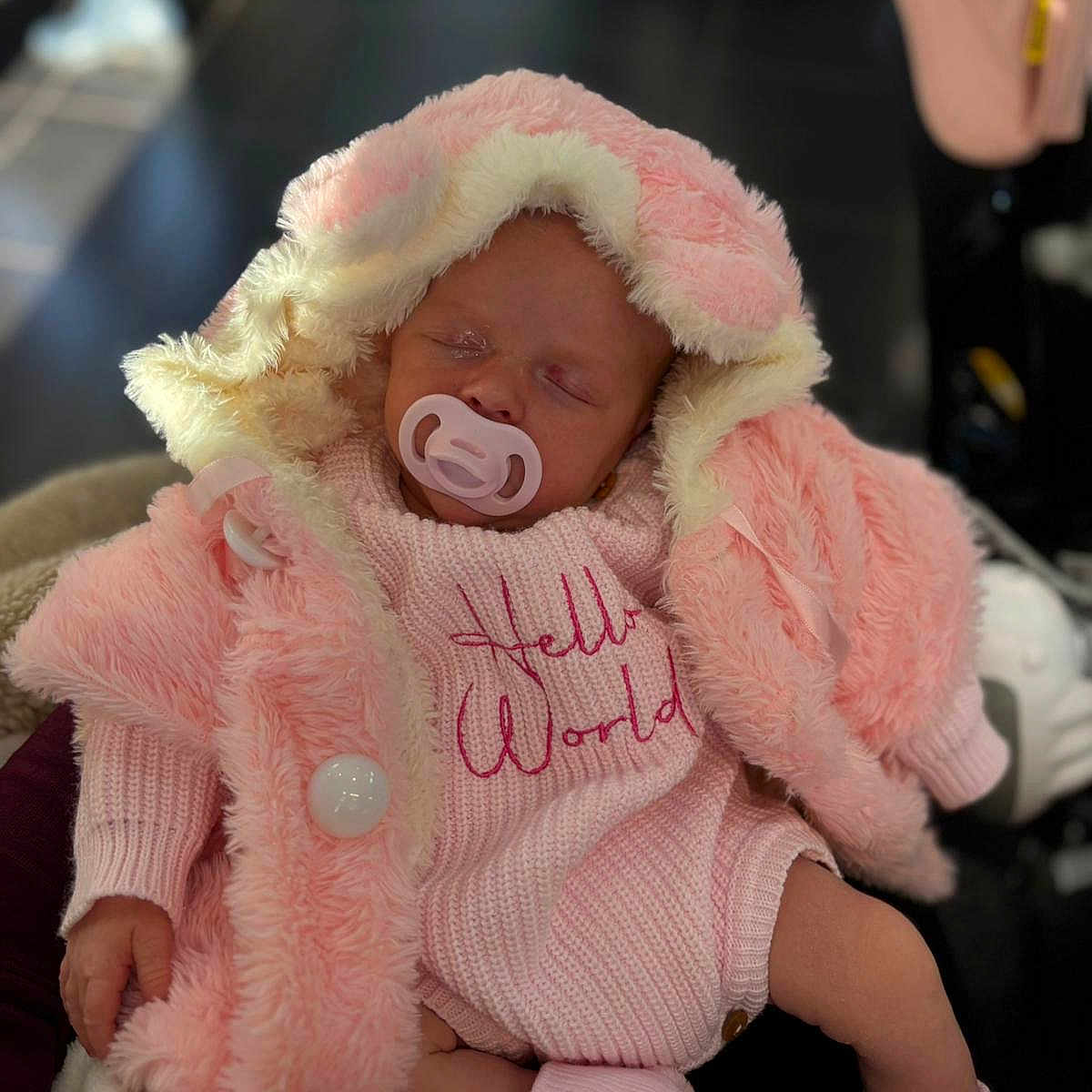 Aria-Rose joined the competition — help win amazing prizes! apparel, baby, child, coat, cuddle, cute, footwear, hand, indoor, infant, knitwear, newborn, pacifier, person, pink, portrait, sleeping, soft, sweater, warm