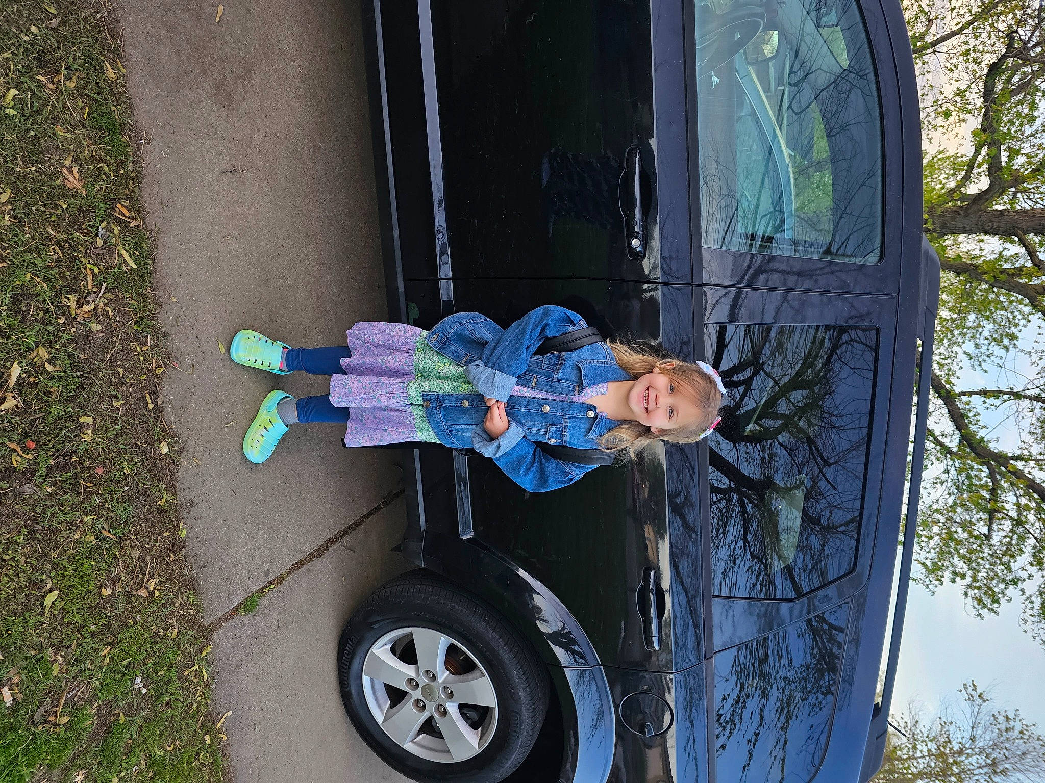 Brinnley joined the competition — help win amazing prizes! auto_part, automotive_exterior, automotive_tire, automotive_wheel_system, bicycle_wheel, car, electric_blue, gas, joy, motor_vehicle, person, rolling, sky, tire, tire_care, tread, tree, trunk, vehicle, vehicle_door