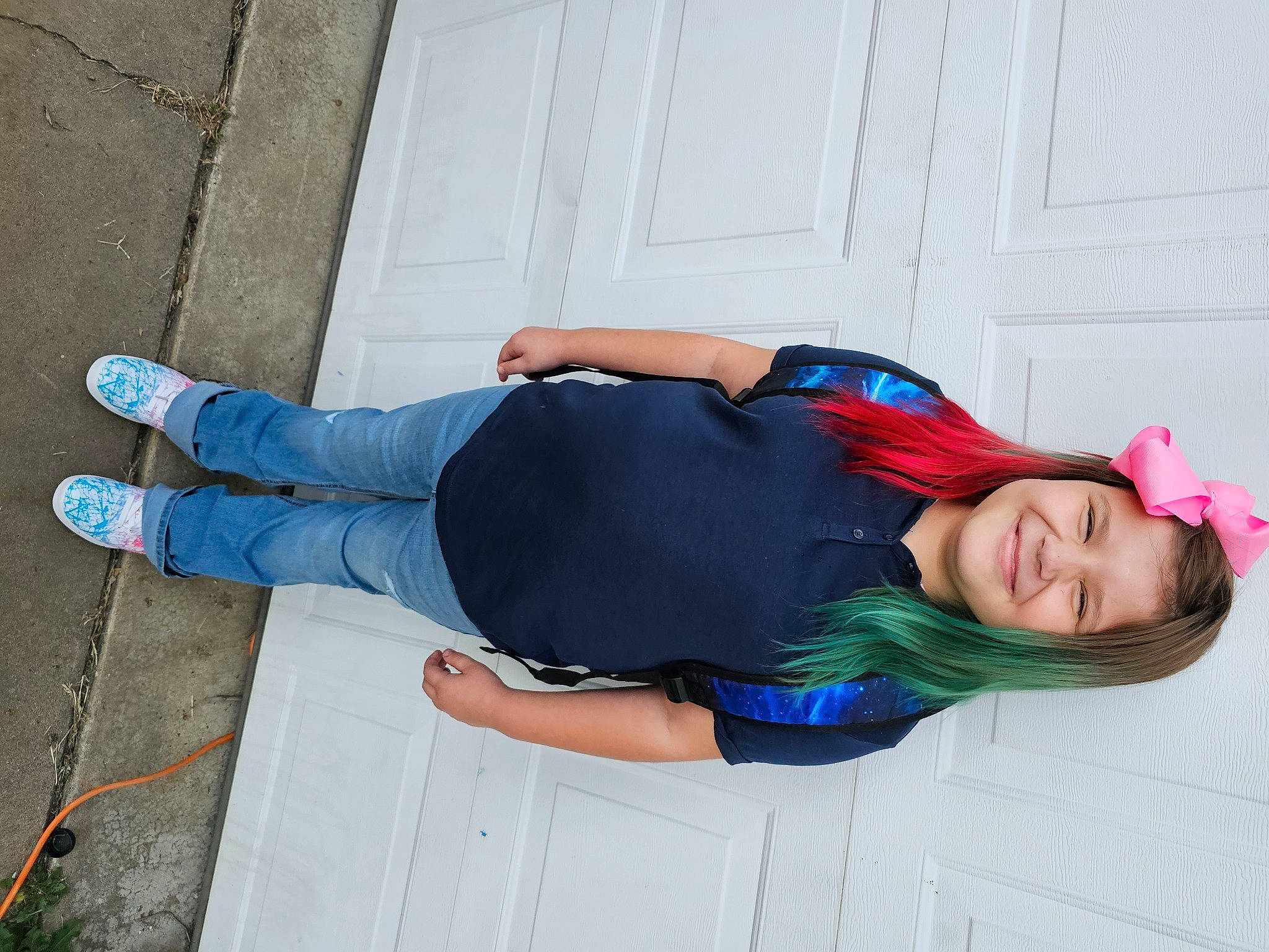 Sophia is registered to the contest to win money with this photo: ankle, blue, clothing, costume, denim, dress, elbow, electric_blue, flooring, foot, happy, human_leg, joy, knee, pattern, person, sitting, smile, thigh, waist