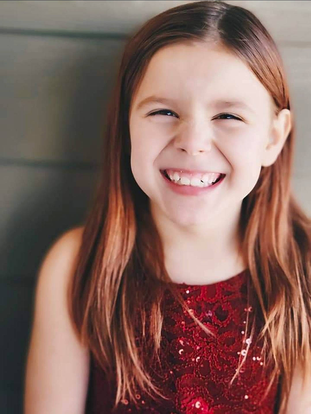 Sophia is registered to the contest to win money with this photo: black_hair, brown_hair, cheek, child, eyelash, flash_photography, fun, gesture, happy, iris, jaw, joy, layered_hair, lip, long_hair, neck, nose, person, skin, sleeve