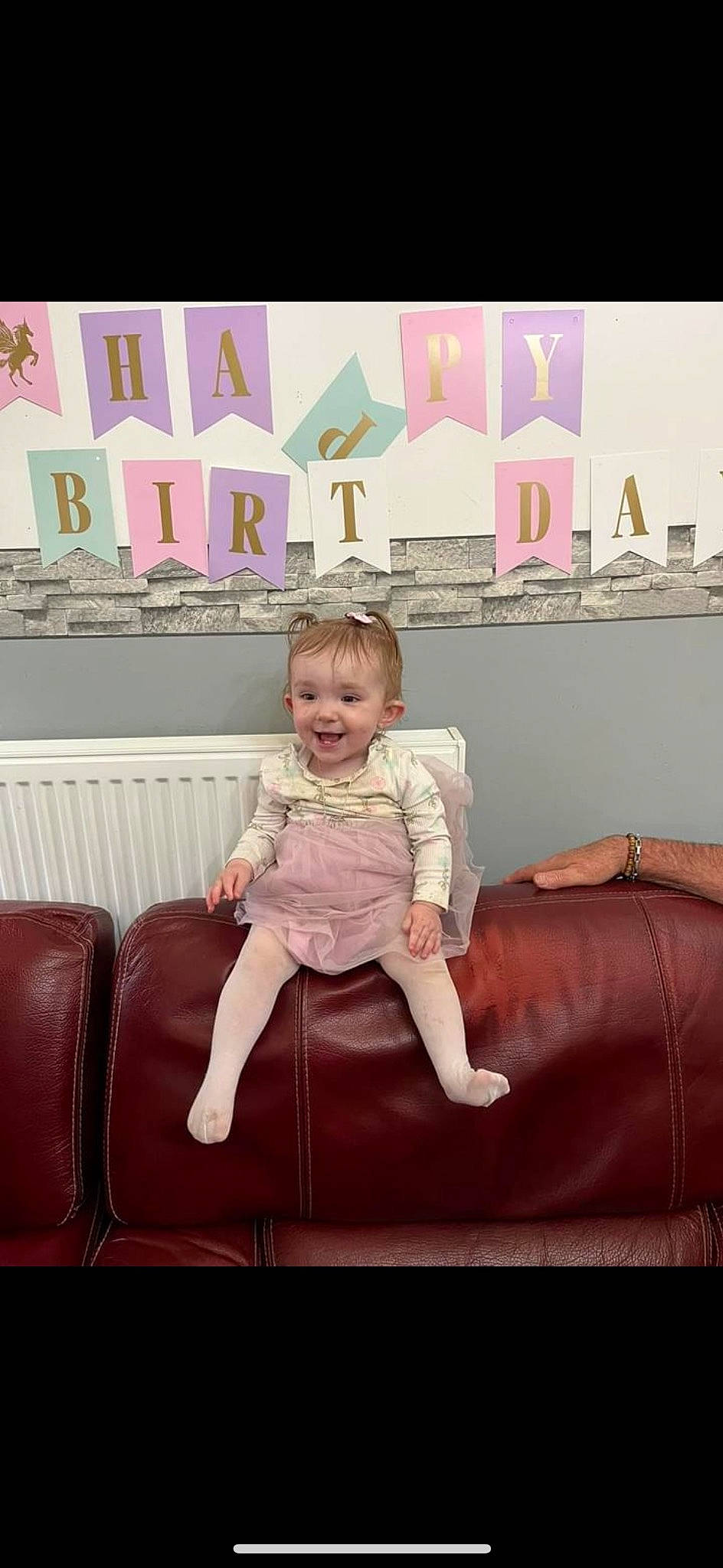 Blanche participe au concours pour gagner de l'argent avec cette photo : baby_toddler_clothing, chair, child, comfort, couch, dress, furniture, happy, joy, magenta, person, pillow, pink, purple, rectangle, room, sitting, sleeve, smile, textile