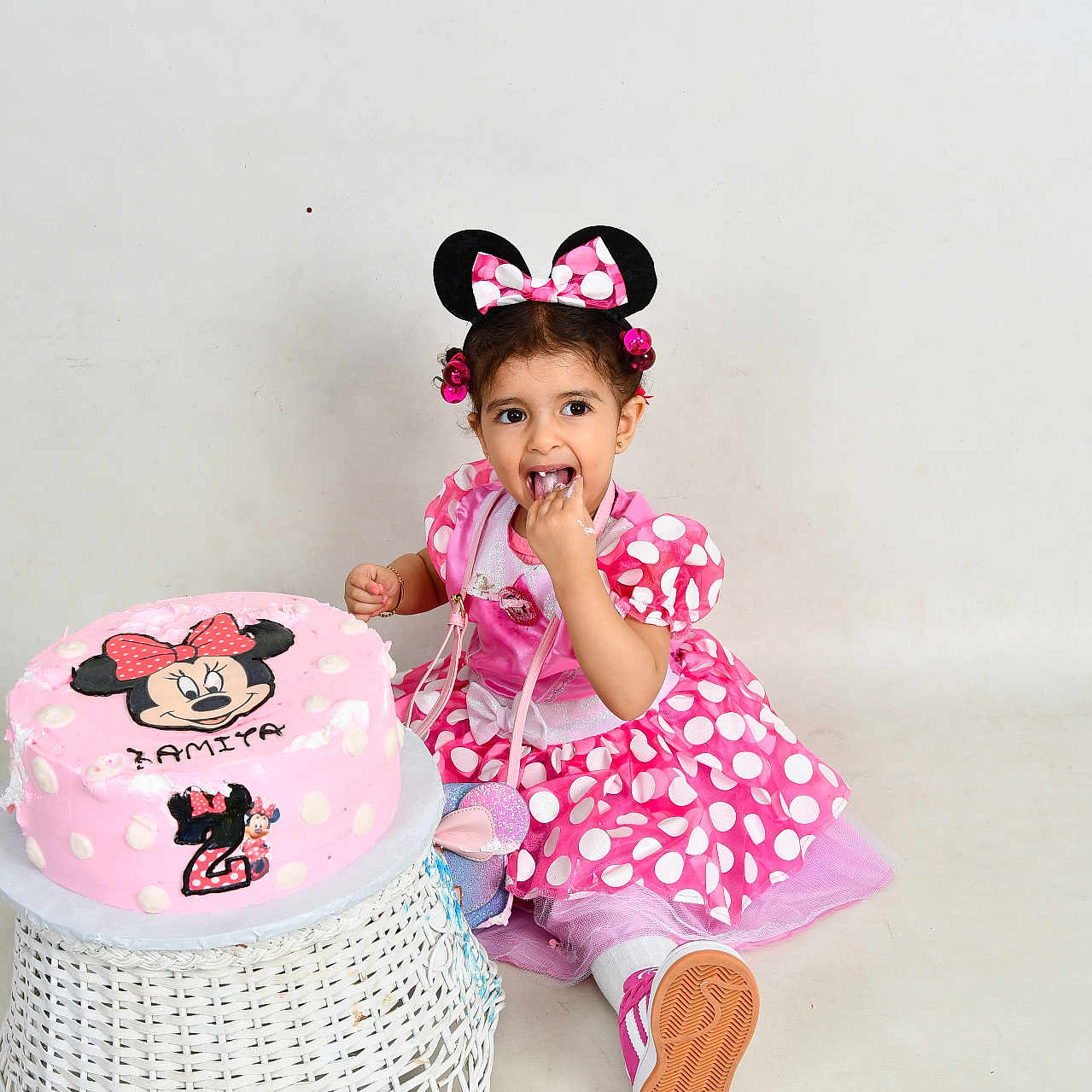 Lamita joined the competition — help win amazing prizes! birthday_cake, cake, celebration, child, cute, food, happy, headband, indoor, minnie_mouse, party, pink_dress, polka_dots, shoes, sitting, smiling, toddler, white_background, wicker_stool, young_child