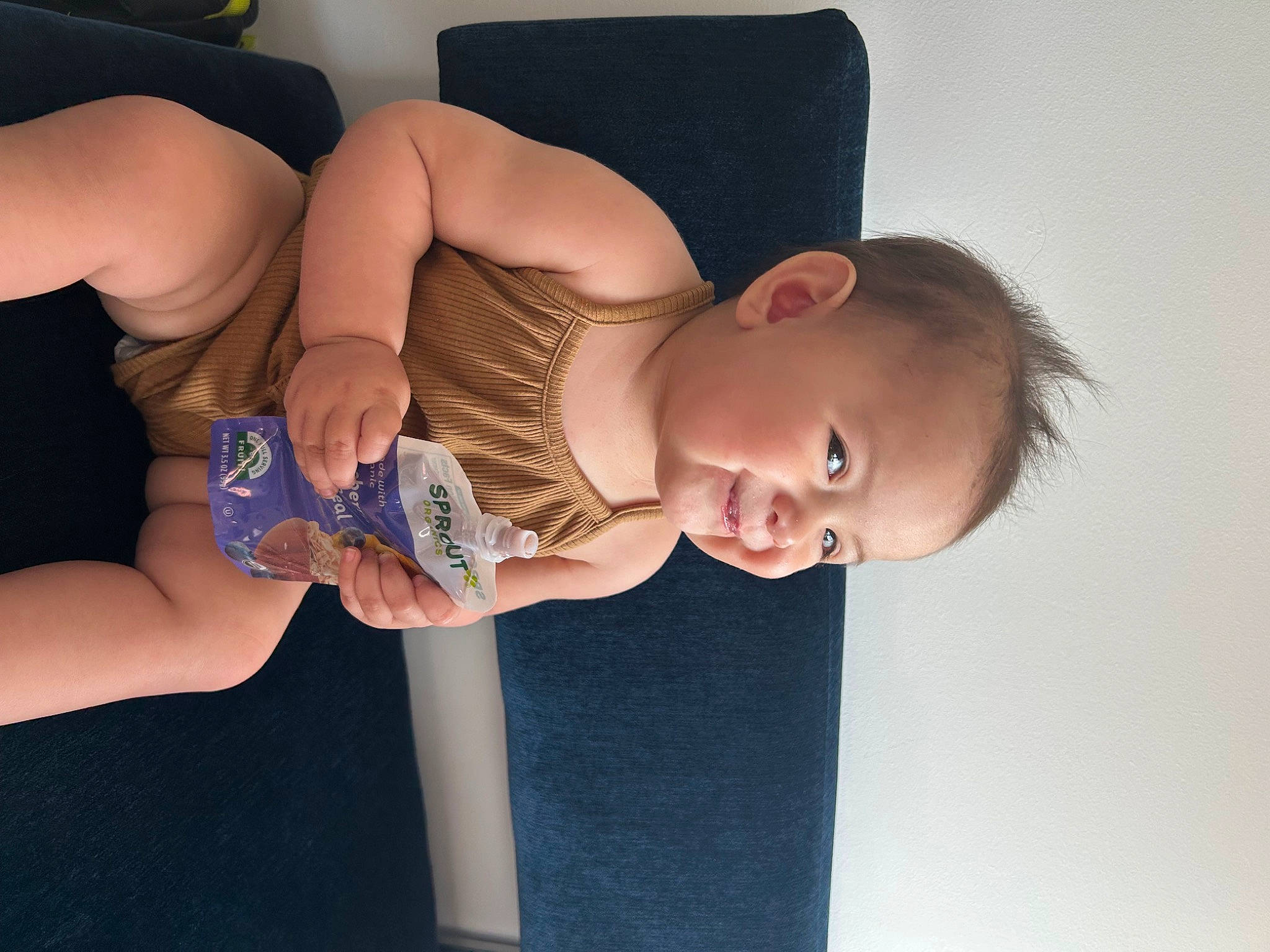 Sirena is registered to the contest to win money with this photo: arm, baby, cheek, dress, elbow, finger, gesture, hand, human_body, iris, joint, leg, mouth, muscle, neck, person, shoulder, skin, stomach, thigh