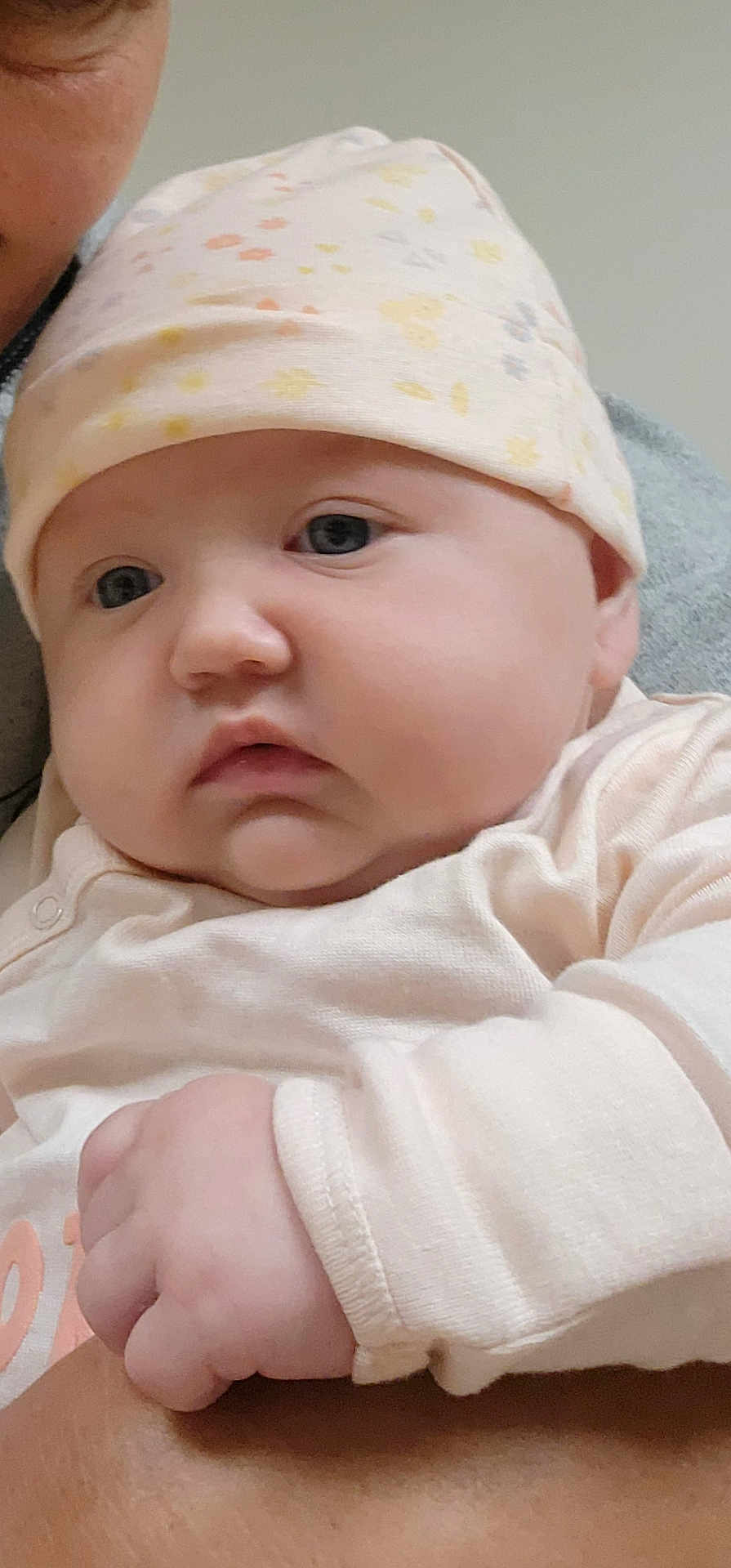 Phenoix joined the competition — help win amazing prizes! baby, infant, hat, clothing, hand, face, skin, person, portrait, cute, newborn, child, expression, holding, closeup, soft, indoors, warm, peaceful, young