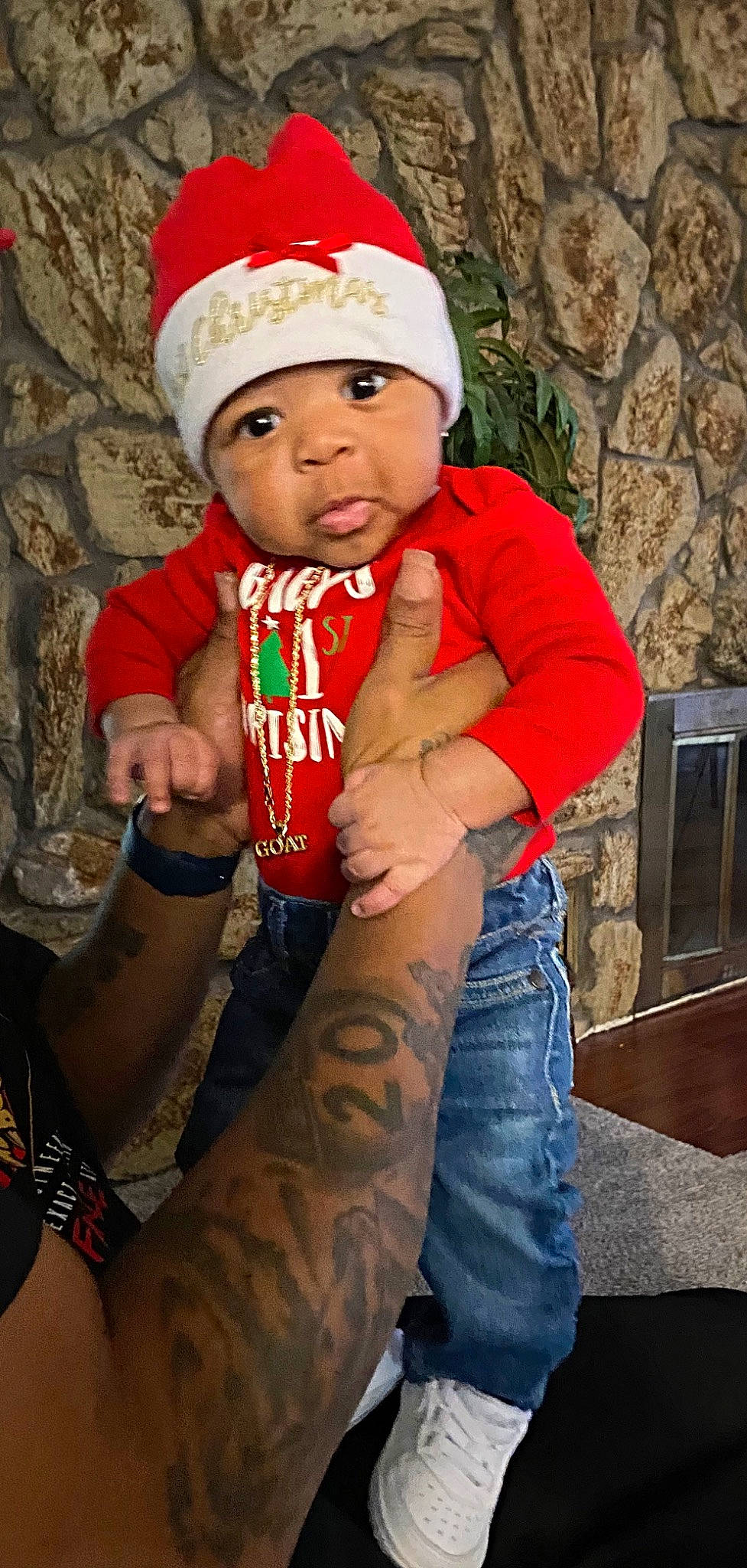 Jeremy joined the competition — help win amazing prizes! arm, baby, cap, child, costume_hat, event, eye, flash_photography, happy, head, headwear, human_body, jeans, lap, organ, person, santa_claus, sleeve, t_shirt, thigh