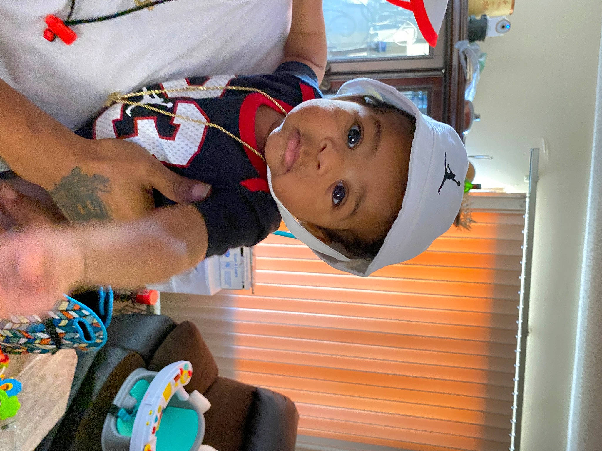 Jeremy is registered to the contest to win money with this photo: baby, baby_products, chest, child, elbow, eyewear, fun, hat, leisure, person, personal_protective_equipment, recreation, room, shorts, smile, t_shirt, toddler, wrist