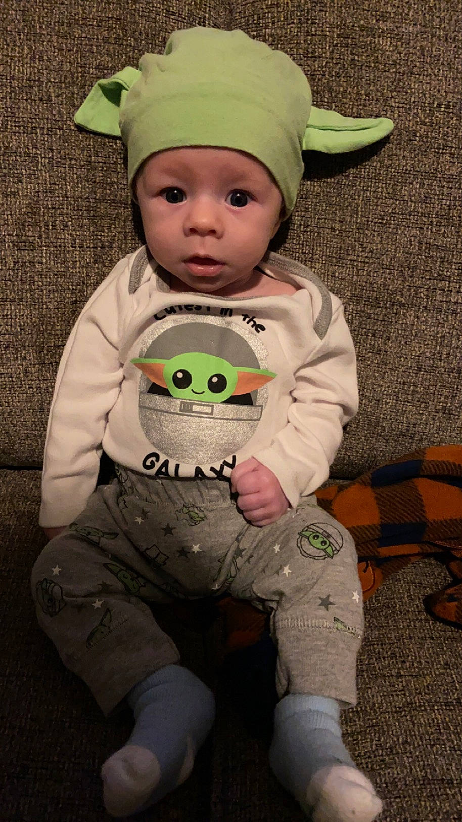 Jonathan joined the competition — help win amazing prizes! baby, baby_toddler_clothing, beanie, cap, cheek, child, clothing, costume_hat, eye, face, fashion_accessory, fun, grass, happy, head, headwear, person, personal_protective_equipment, sitting, sleeve