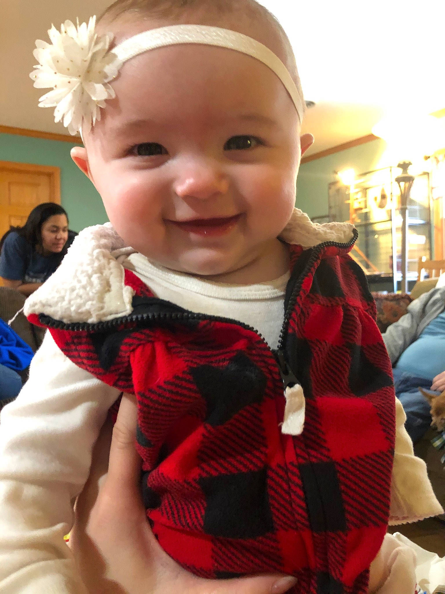 Carlee joined the competition — help win amazing prizes! baby, cheek, child, christmas, design, face, head, holiday, joy, outerwear, pattern, person, plaid, skin, sleeve, smile, tartan, textile, toddler